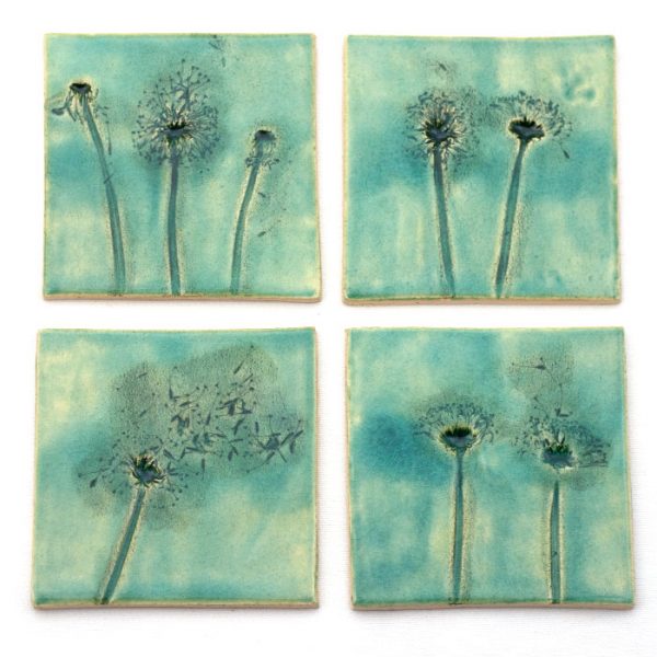 Handmade turquoise green kitchen tiles with floral pattern